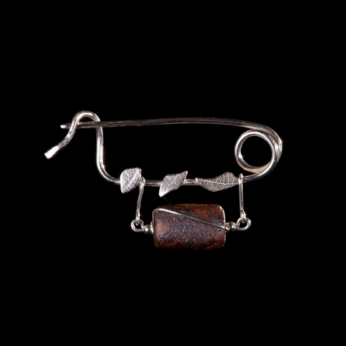 Ceramic log bead with silver leaves on silver brooch